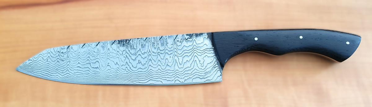 Damast-Kochmesser, Holzgriff dunkelbraun, Klinge Damaszener Stahl, rund 150 Lagen, charakteristische, rustikale Schmiedeoberfl&auml;che, Griff aus Holz, Gesamtl&auml;nge 325 mm, Klingenl&auml;nge 190 mm, Klingenst&auml;rke 3mm?d=2026-02-26 17:22:12